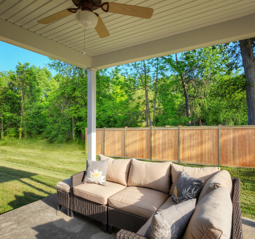 Example of a mid-sized transitional exterior home design