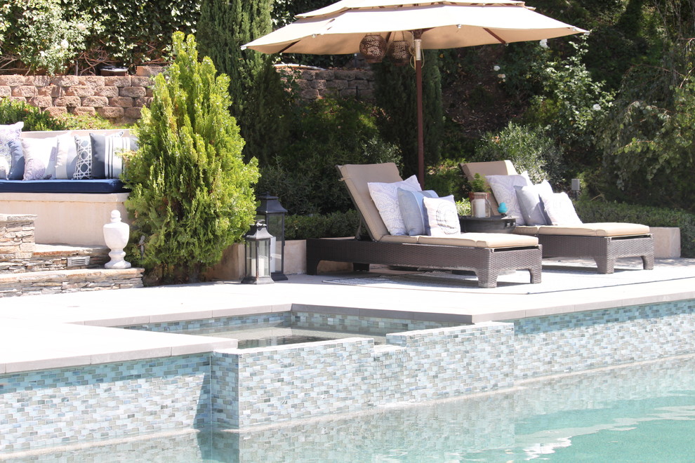 Pool - large transitional backyard concrete and rectangular pool idea in Los Angeles