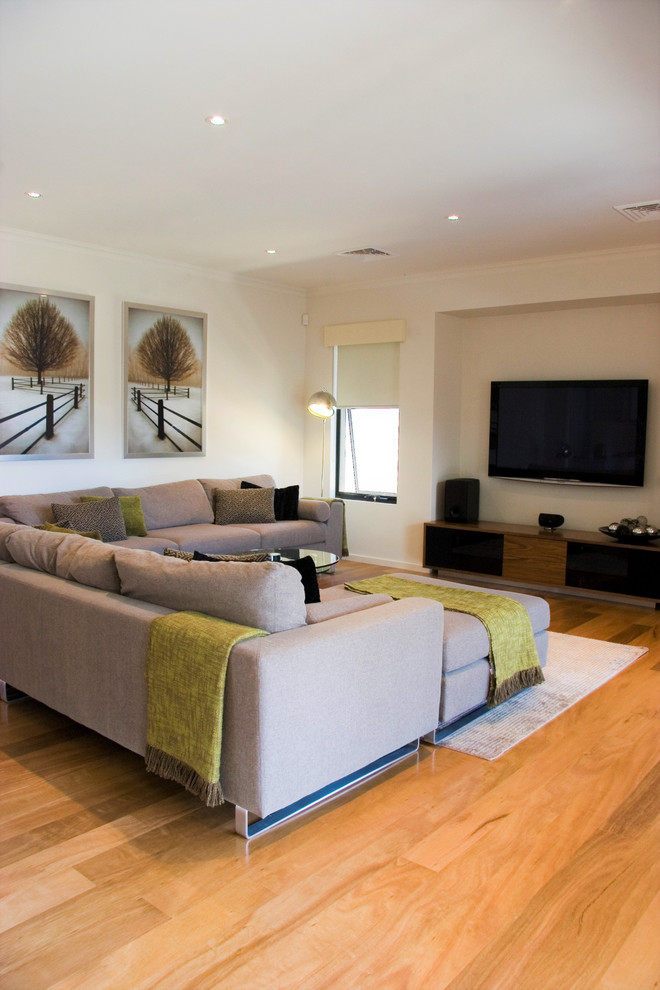 Large modern formal open concept living room in Perth with white walls, light hardwood floors, a corner fireplace, a metal fireplace surround, yellow floor and a wall-mounted tv.
