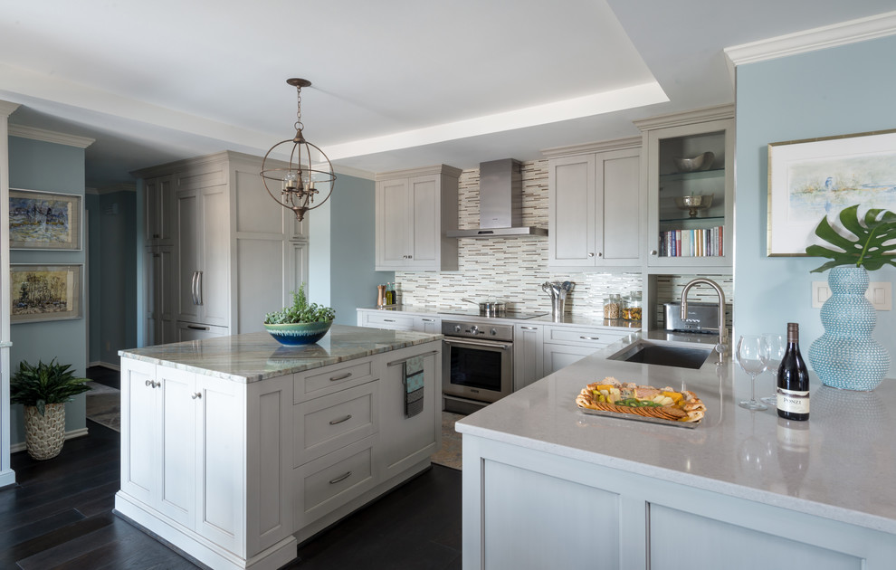 This is an example of a mid-sized transitional u-shaped eat-in kitchen in Dallas with an undermount sink, shaker cabinets, grey cabinets, quartz benchtops, multi-coloured splashback, mosaic tile splashback, panelled appliances, dark hardwood floors and with island.