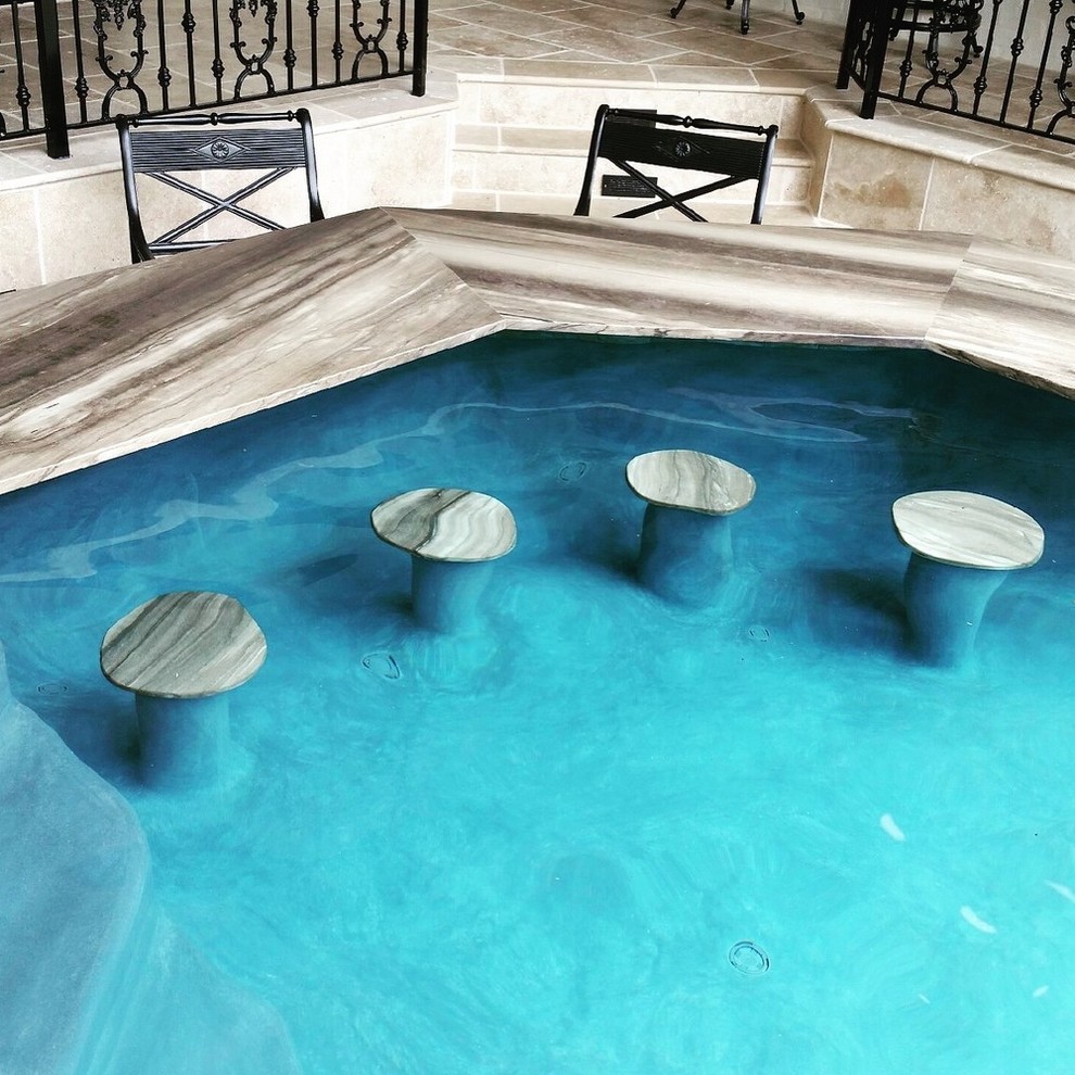 Pool - large transitional backyard custom-shaped and stamped concrete infinity pool idea