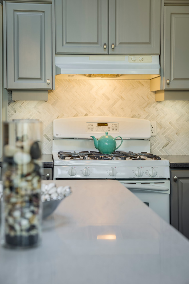 Inspiration for a large transitional laminate floor and gray floor eat-in kitchen remodel in Toronto with green walls and no fireplace