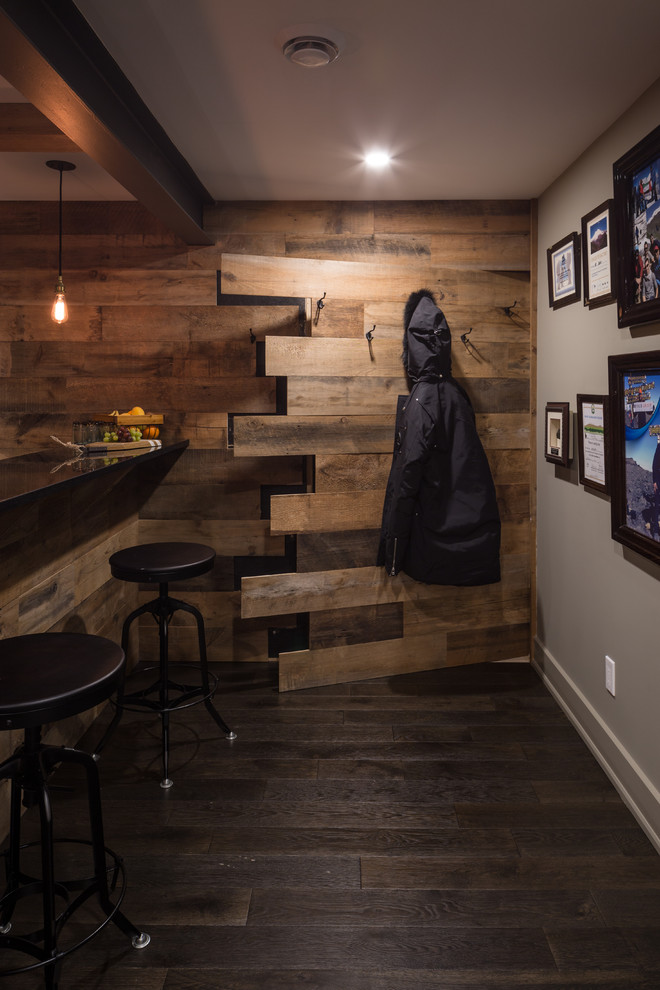 Country entryway in Ottawa with dark hardwood floors and multi-coloured walls.