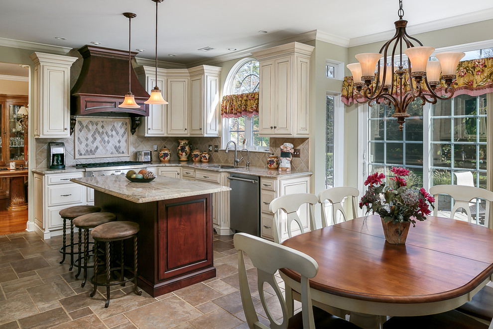 Inspiration for a timeless l-shaped open concept kitchen remodel in Philadelphia with an undermount sink, raised-panel cabinets, white cabinets, beige backsplash, stainless steel appliances and an island