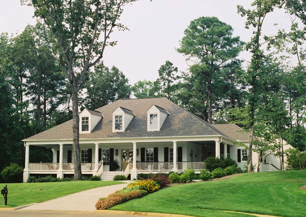 Traditional exterior in Birmingham with wood siding and a hip roof.