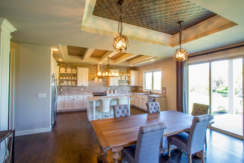 Open concept kitchen - mid-sized transitional u-shaped dark wood floor and brown floor open concept kitchen idea in Cincinnati with a double-bowl sink, shaker cabinets, white cabinets, granite countertops, multicolored backsplash, matchstick tile backsplash, stainless steel appliances and an island