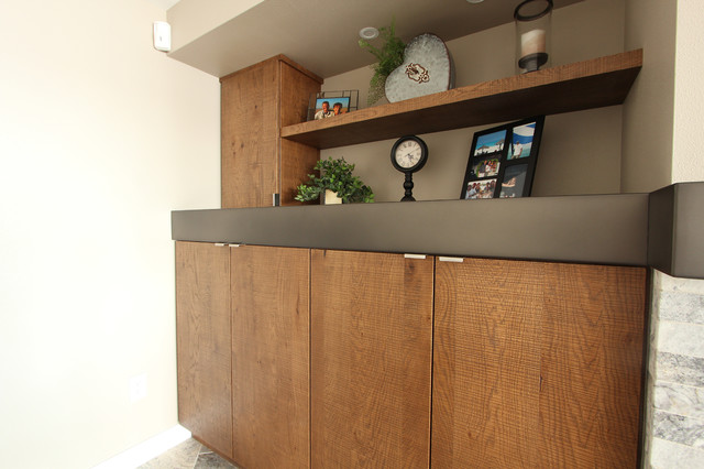 Rough Sawn Euro Oak Built In Cabinets with Custom Metal Mantle rustikt-kaelder