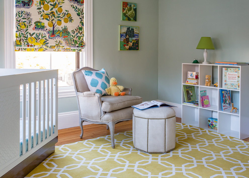 Design ideas for a transitional gender-neutral nursery in Boston with green walls, medium hardwood floors and yellow floor.