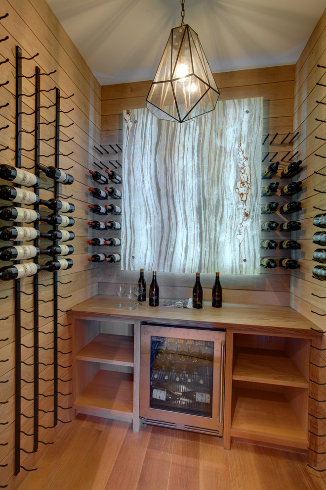 Inspiration for a transitional wine cellar in New York.