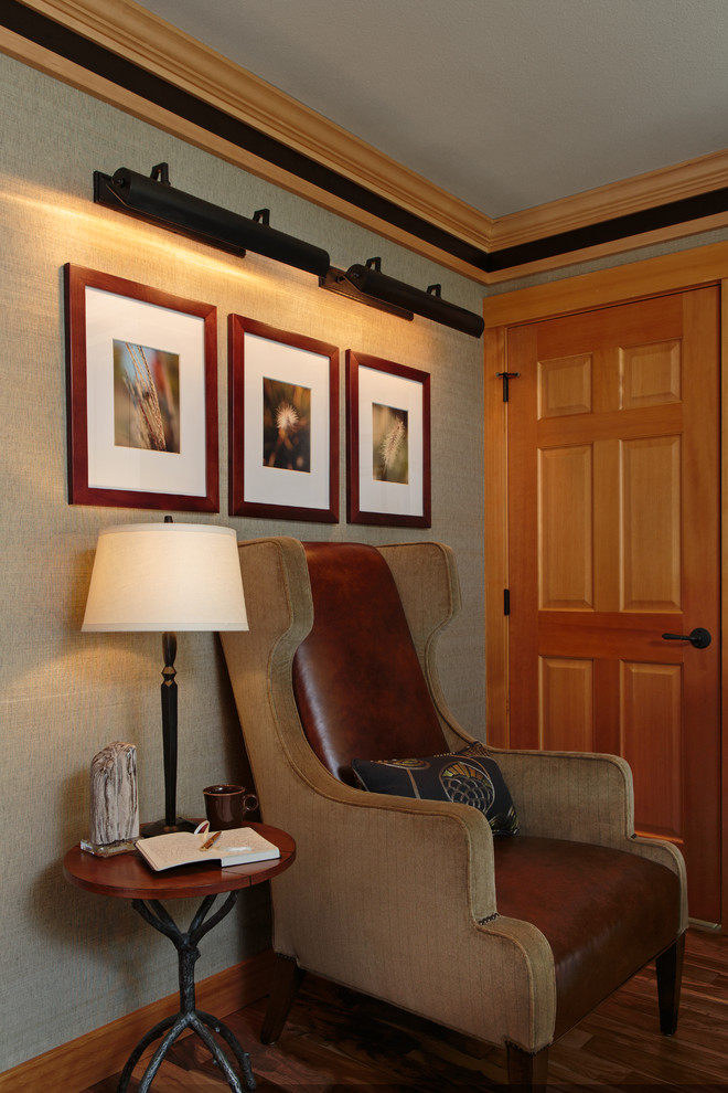 Mid-sized transitional built-in desk medium tone wood floor study room photo in Portland with beige walls