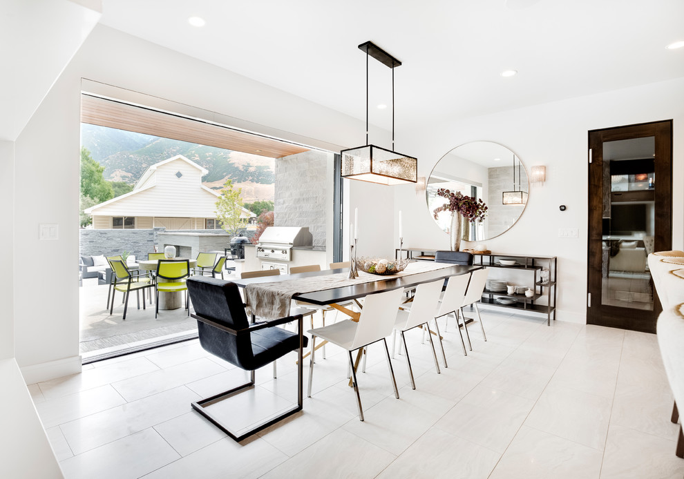 This is an example of a contemporary dining room in Salt Lake City with white walls and white floor.