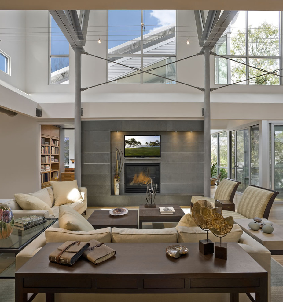 Photo of a large contemporary open concept living room in Houston with a standard fireplace and a wall-mounted tv.