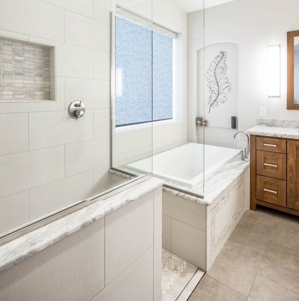 Mid-sized transitional master gray tile and porcelain tile porcelain tile and brown floor drop-in bathtub photo in Phoenix with shaker cabinets, medium tone wood cabinets, a two-piece toilet, white walls, an undermount sink and granite countertops