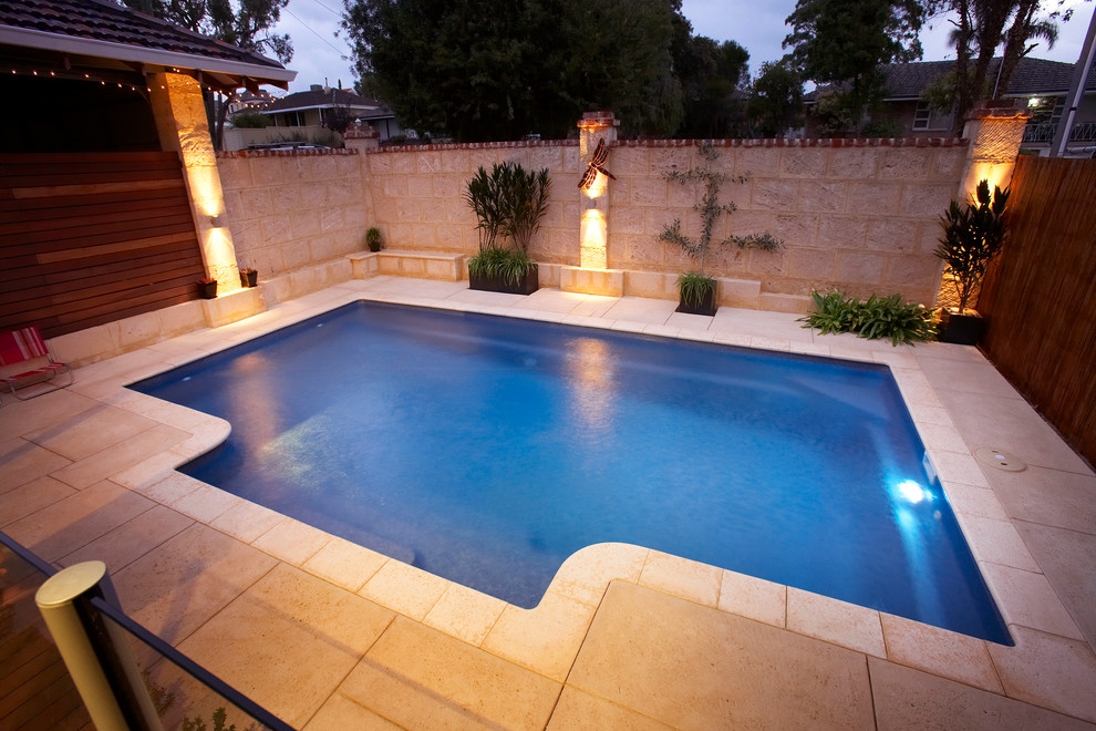 This is an example of a mid-sized contemporary backyard pool in Perth.