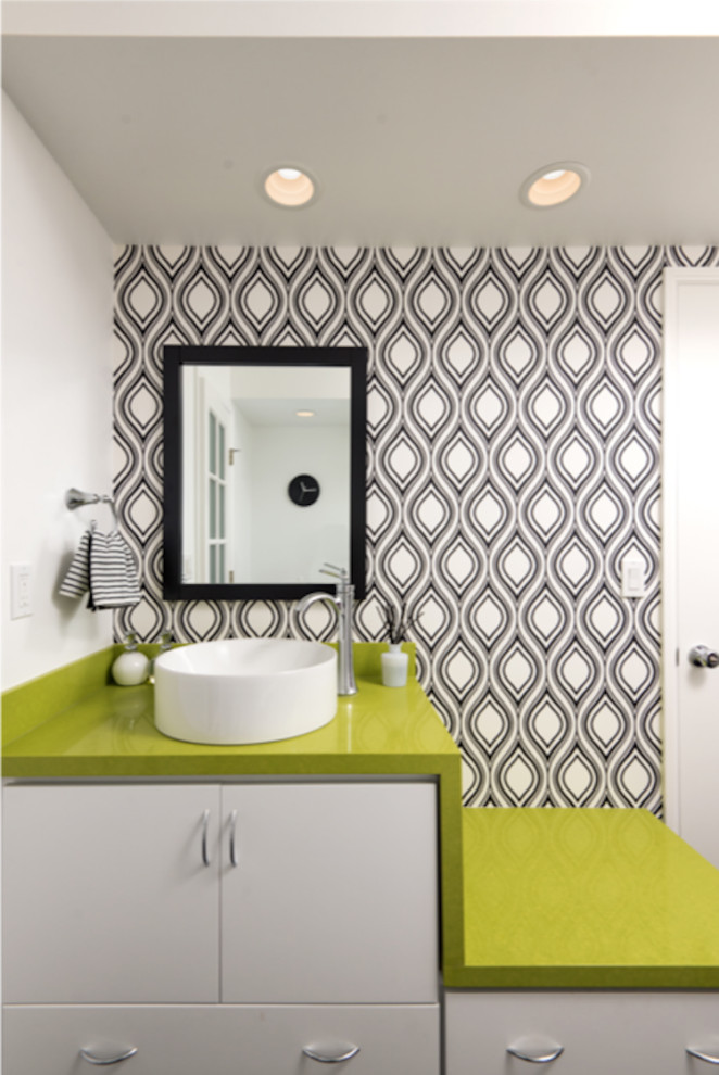 Example of a minimalist white tile and ceramic tile porcelain tile, black floor, single-sink and wallpaper bathroom design in San Diego with flat-panel cabinets, white cabinets, white walls, a vessel sink, quartz countertops, green countertops and a floating vanity