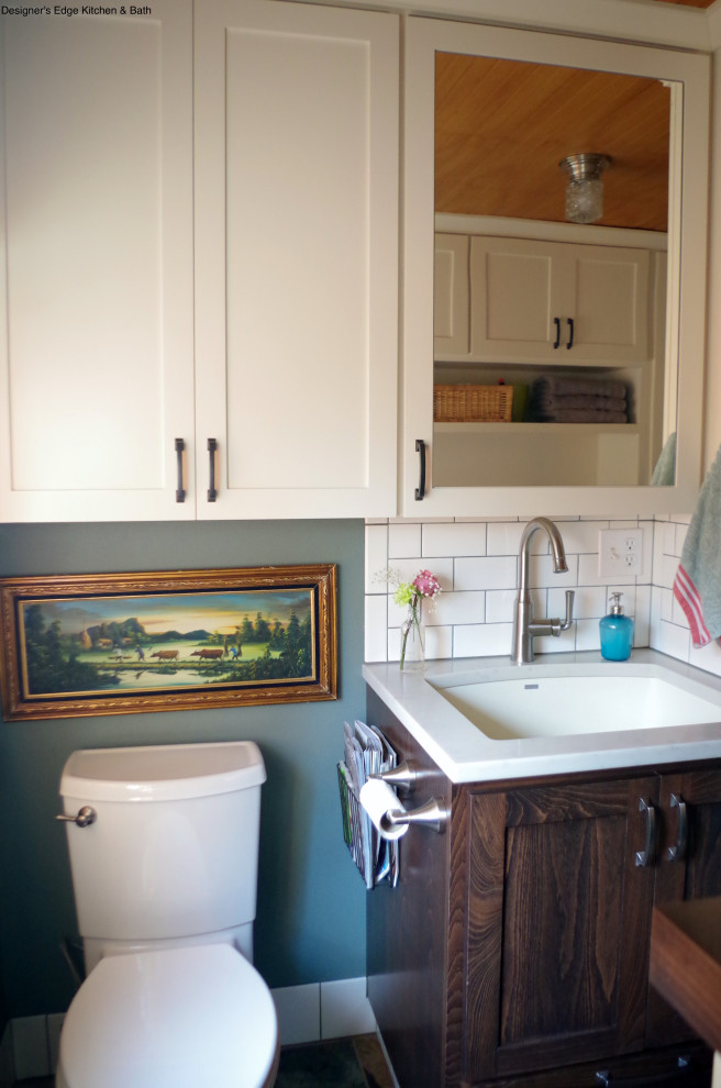 Small arts and crafts single-wall utility room in Portland with a single-bowl sink, shaker cabinets, white cabinets, wood benchtops, green walls, slate floors, a side-by-side washer and dryer, brown benchtop and wood.
