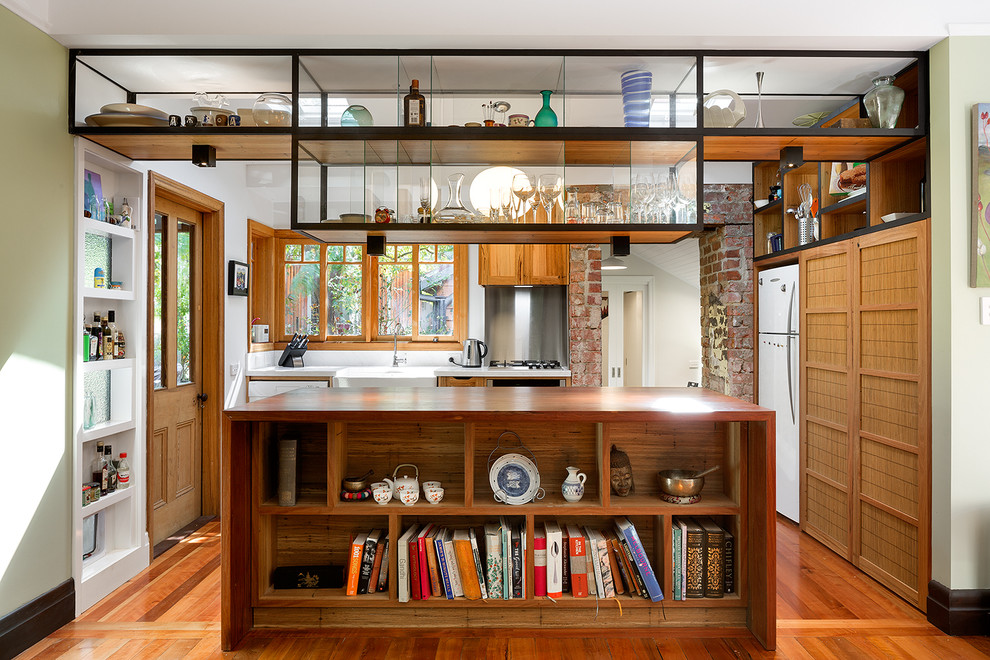 Design ideas for an eclectic l-shaped kitchen in Melbourne with a farmhouse sink and with island.
