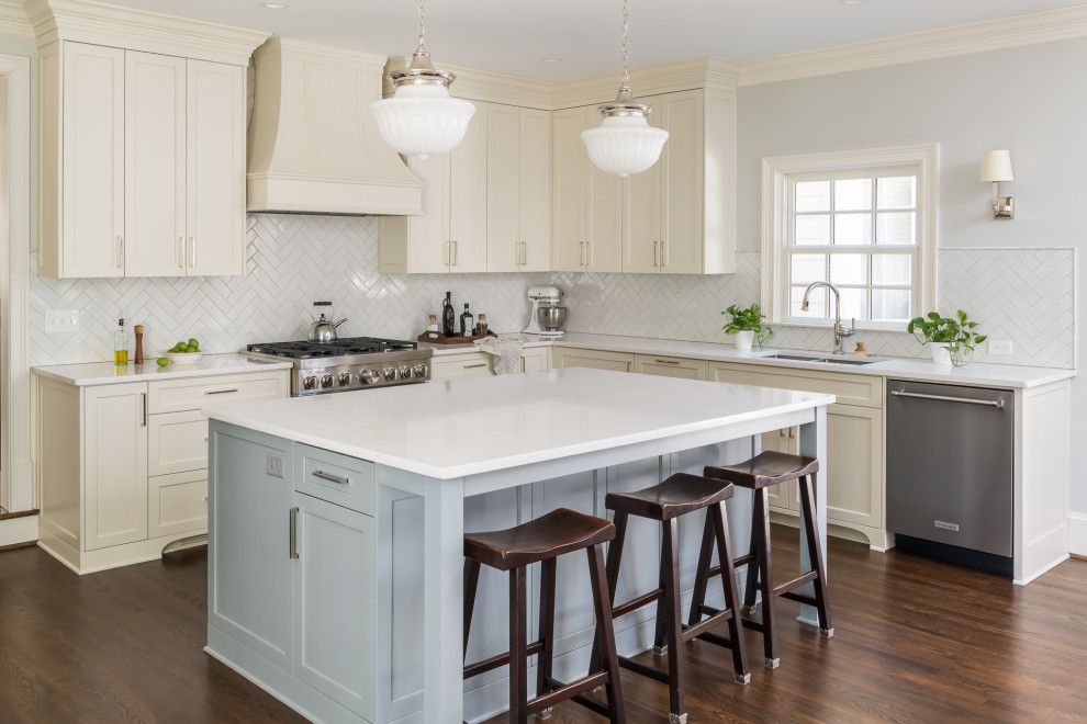 Inspiration for a large timeless u-shaped dark wood floor and brown floor eat-in kitchen remodel in Atlanta with an undermount sink, shaker cabinets, white cabinets, quartz countertops, white backsplash, mosaic tile backsplash, stainless steel appliances, an island and white countertops