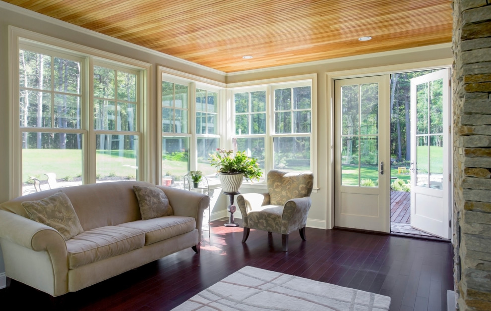 Design ideas for a mid-sized traditional sunroom in Boston with dark hardwood floors, a stone fireplace surround and a standard ceiling.