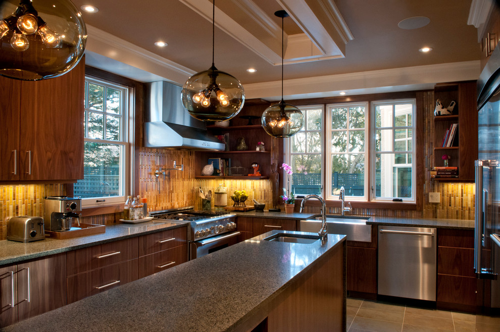 This is an example of a contemporary kitchen in Boston with granite benchtops and stainless steel appliances.