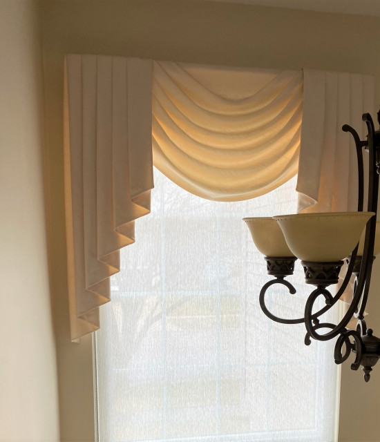 Shade under swag cascade valance on high window Traditional
