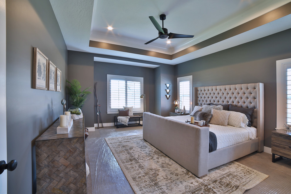 This is an example of a large modern master bedroom in Salt Lake City with grey walls, carpet, no fireplace and grey floor.
