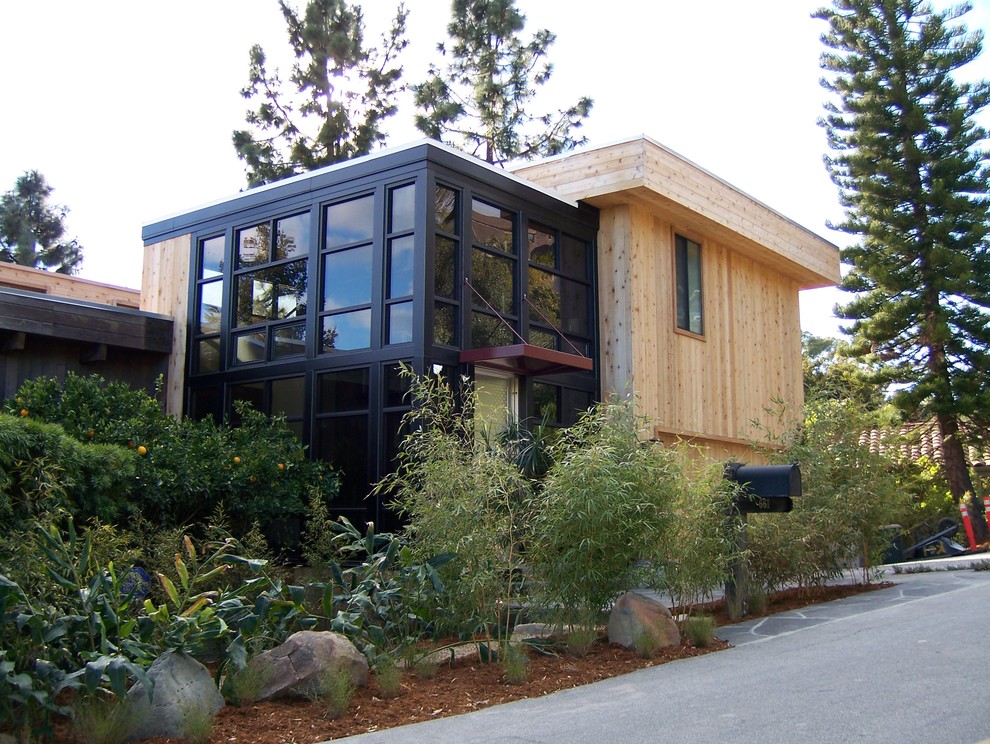 Design ideas for a contemporary exterior in Santa Barbara with mixed siding.