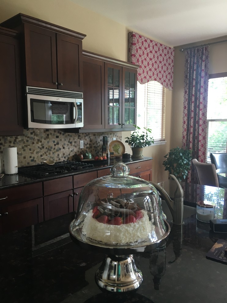 Example of a transitional home design design in Denver