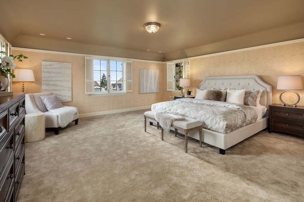 Photo of a large classic master bedroom in Seattle with beige walls, carpet and beige floors.