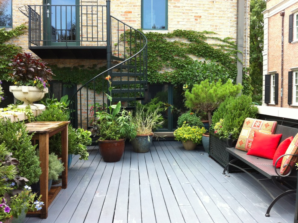 Design ideas for a traditional rooftop and first floor deck in Chicago with no cover.