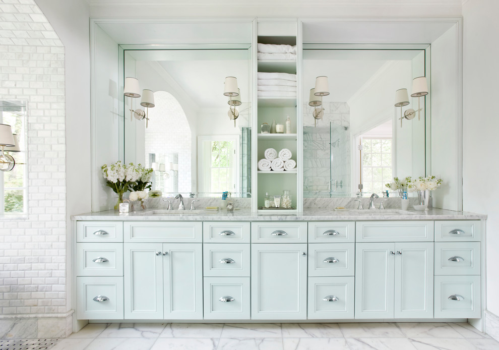 Photo of a large traditional master bathroom in Atlanta with blue cabinets, recessed-panel cabinets, white tile, subway tile, white walls, marble floors, an undermount sink and marble benchtops.