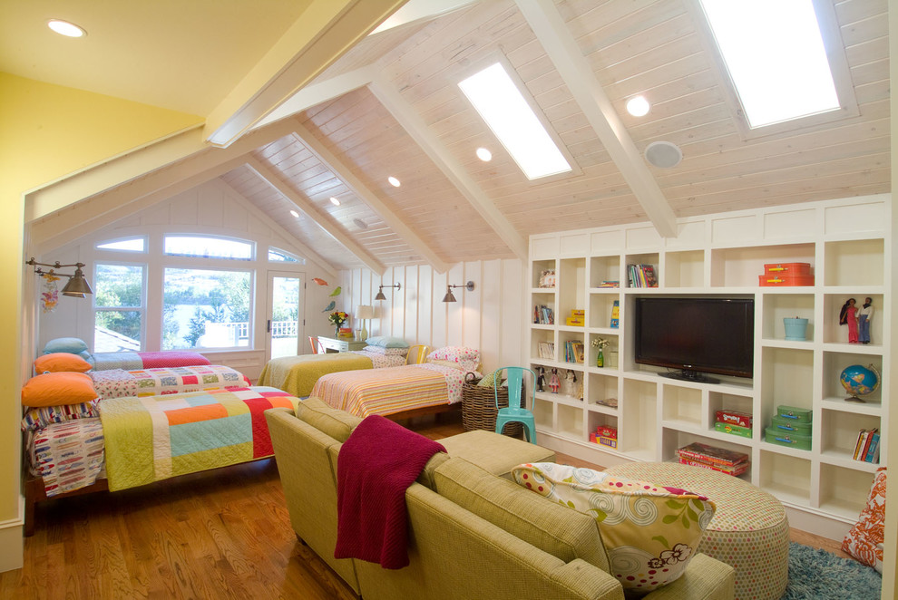 Large traditional gender-neutral kids' bedroom in Salt Lake City with medium hardwood floors and white walls for kids 4-10 years old.