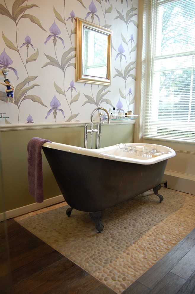 Traditional bathroom in Surrey with a claw-foot tub, pebble tile, multi-coloured walls and pebble tile floors.
