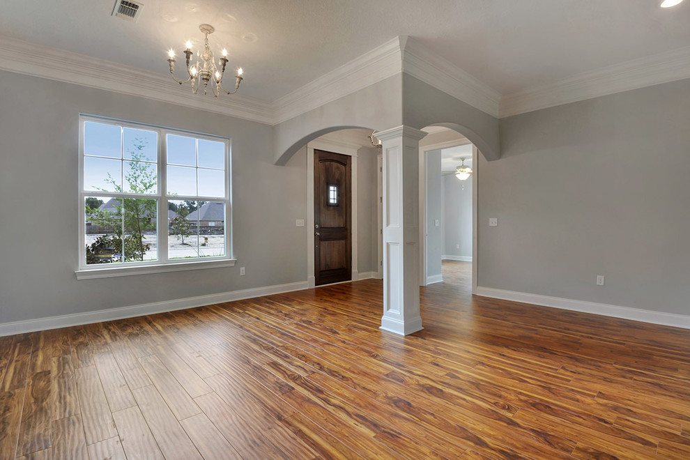 Inspiration for a mid-sized transitional dark wood floor foyer remodel with gray walls and a dark wood front door