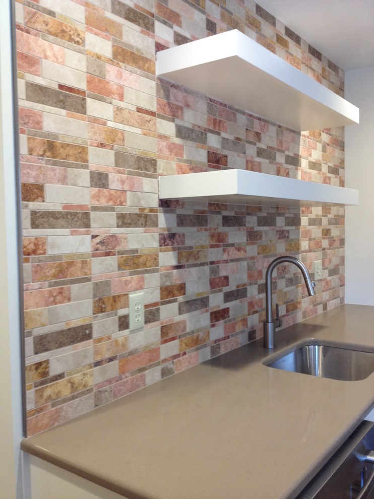 Inspiration for a mid-sized transitional l-shaped utility room remodel with an undermount sink, shaker cabinets, white cabinets, quartz countertops, beige walls and a side-by-side washer/dryer