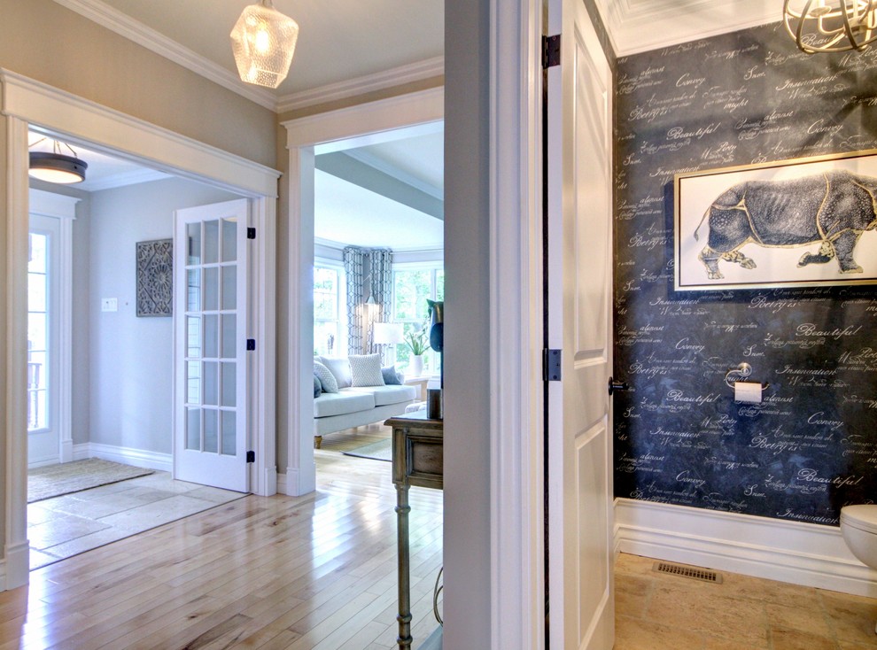 Example of a mid-sized transitional medium tone wood floor and beige floor vestibule design with gray walls and a glass front door