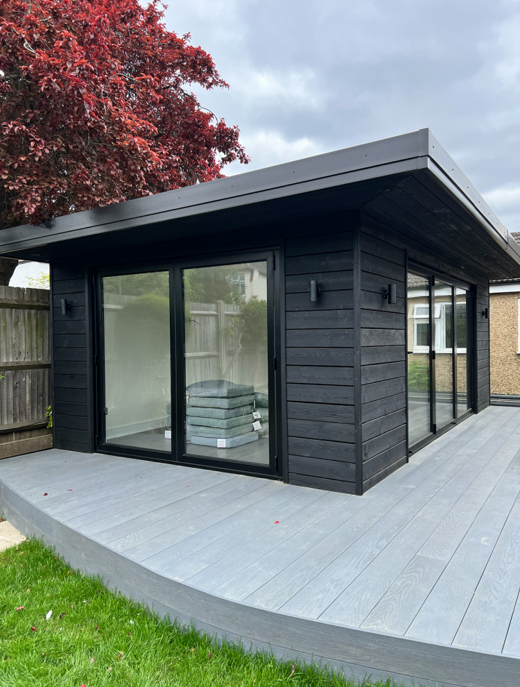 Photo of a mid-sized contemporary shed and granny flat in Surrey.