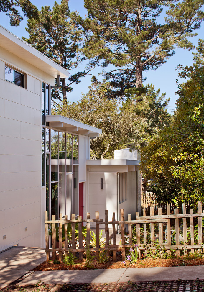 Midcentury white exterior in San Francisco with a flat roof.