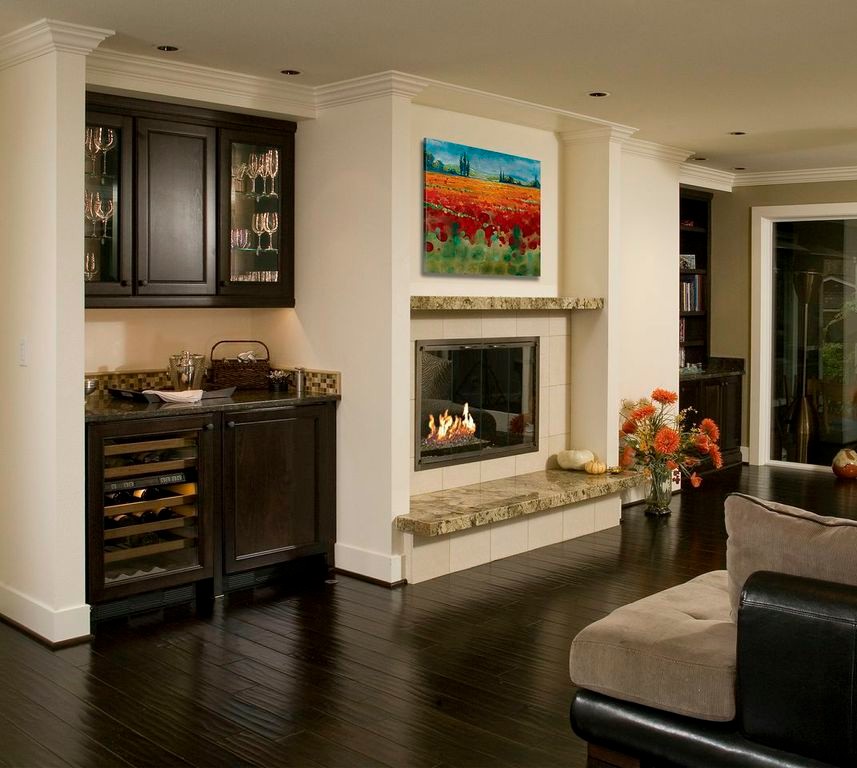 Inspiration for a large traditional open concept living room in Seattle with a home bar, white walls, dark hardwood floors, a standard fireplace and a tile fireplace surround.