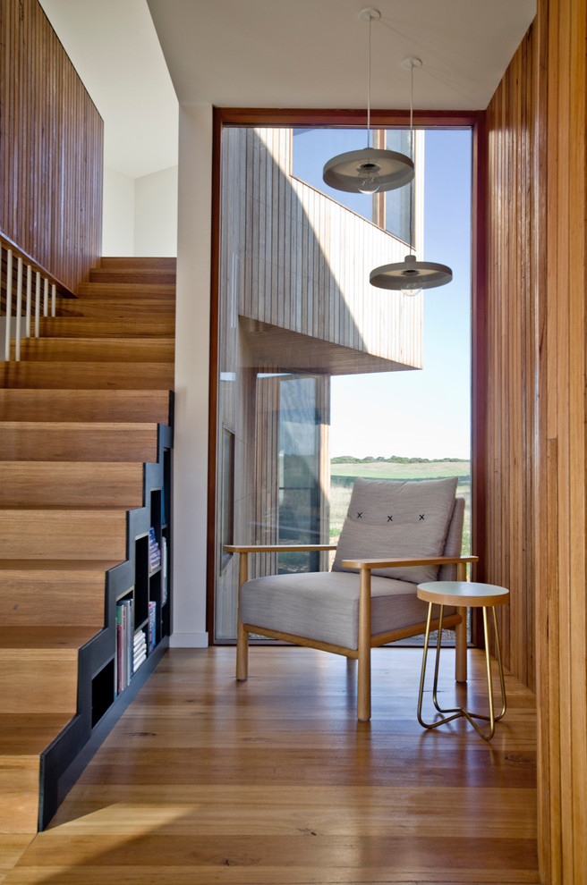 Photo of a mid-sized contemporary wood straight staircase in Geelong with wood risers.