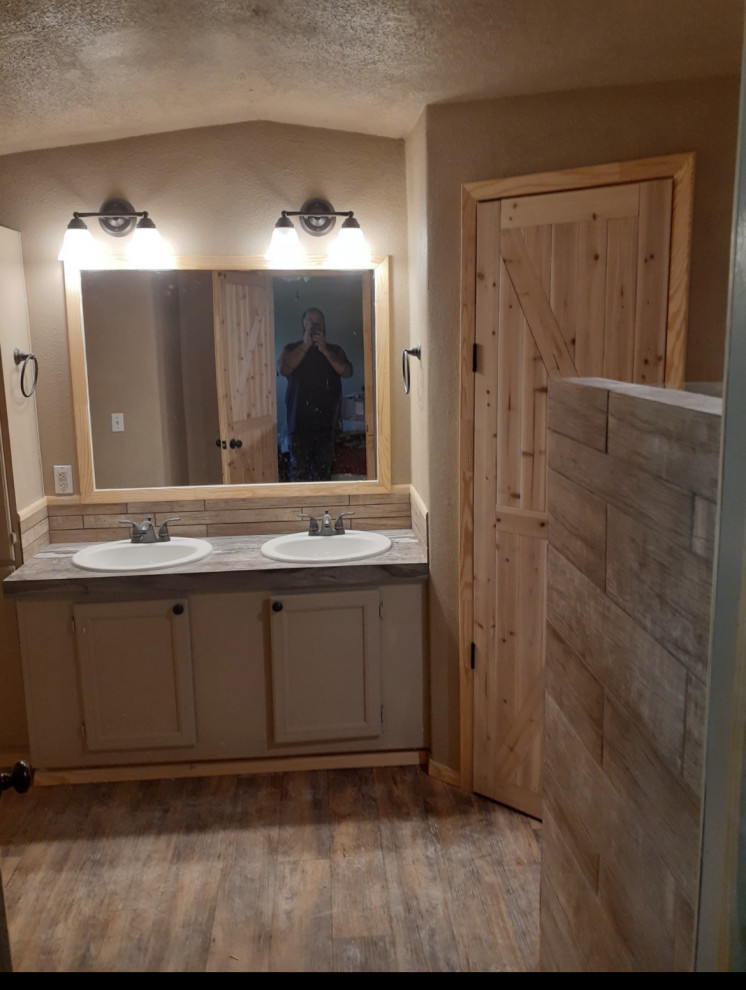 Photo of a mid-sized country master bathroom in Other with shaker cabinets, beige cabinets, an alcove shower, a two-piece toilet, multi-coloured tile, ceramic tile, beige walls, linoleum floors, a drop-in sink, solid surface benchtops, multi-coloured floor, a hinged shower door, multi-coloured benchtops, a shower seat, a double vanity, a built-in vanity, coffered and wallpaper.