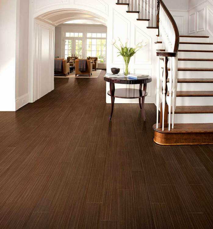 Entryway - traditional light wood floor and brown floor entryway idea with white walls