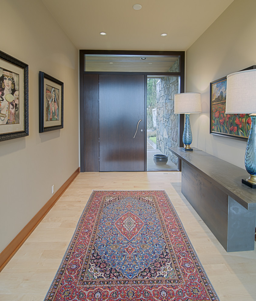 Photo of a contemporary entryway in Portland with beige walls.