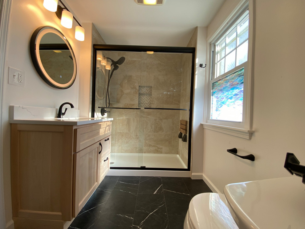 Inspiration for a mid-sized modern 3/4 ceramic tile, black floor and single-sink bathroom remodel in New York with beige cabinets, a one-piece toilet, white walls, an integrated sink, a niche and a built-in vanity