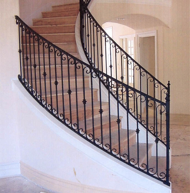 Interior wrought iron stair rails with newel posts, baluster collars