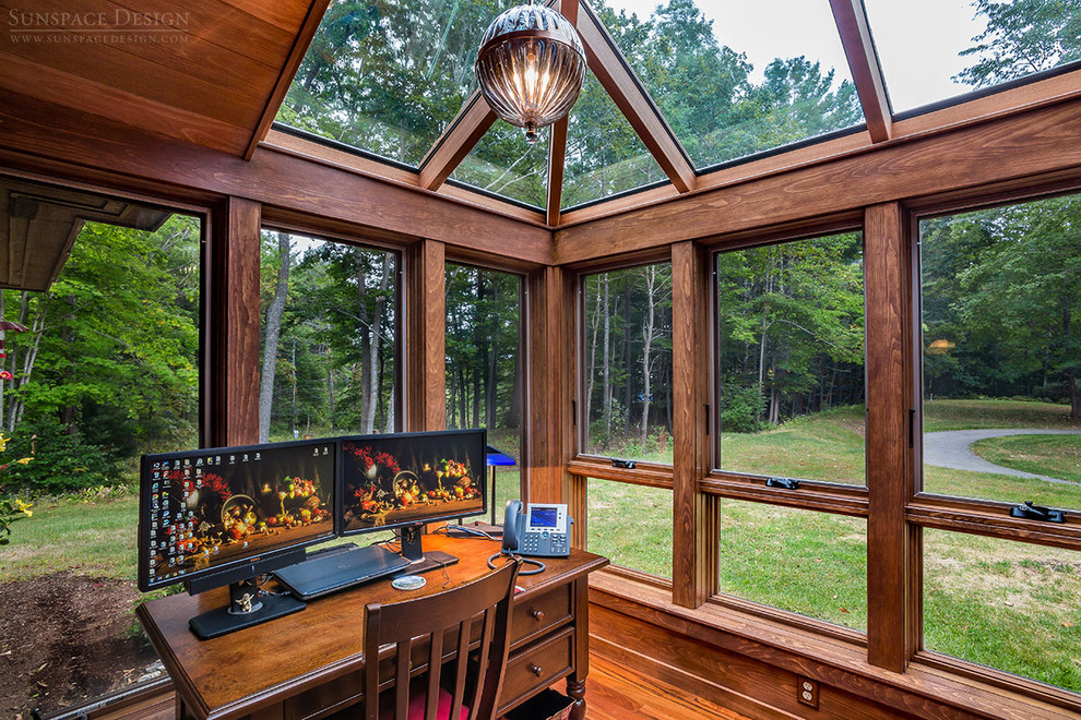 This is an example of a small traditional sunroom in Boston with dark hardwood floors, no fireplace and a glass ceiling.