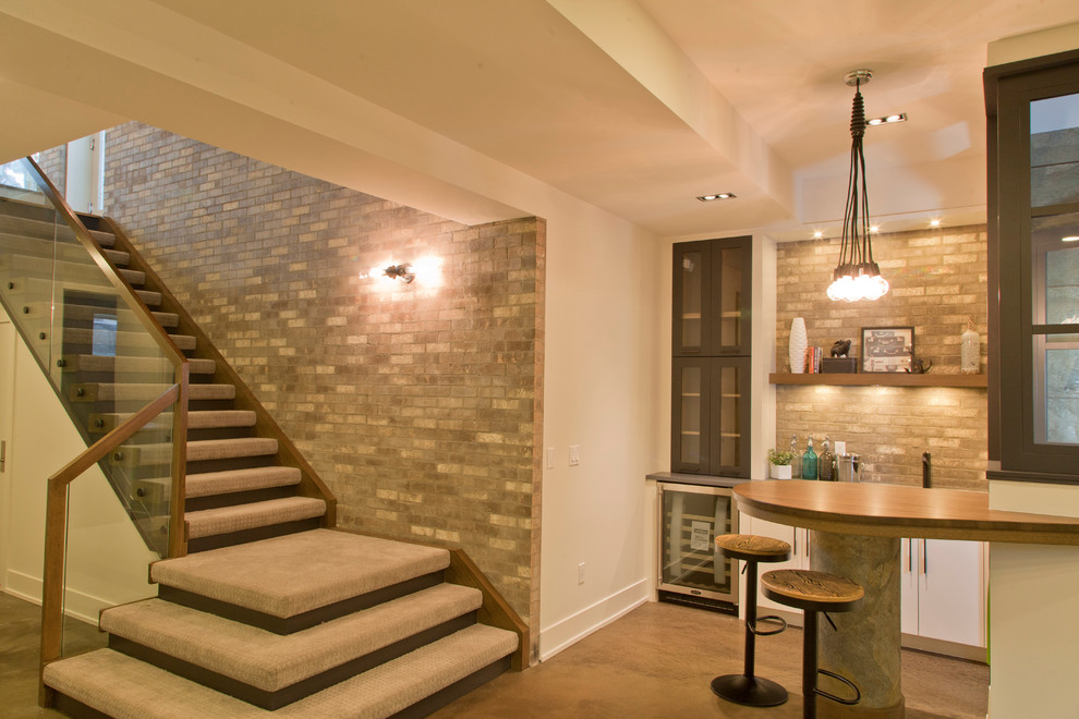 Mid-sized transitional carpeted straight staircase photo in Calgary