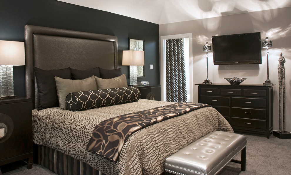 This is an example of a mid-sized transitional guest bedroom in Los Angeles with black walls, carpet and grey floor.