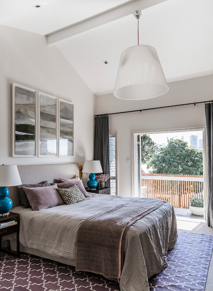 This is an example of a mid-sized transitional bedroom in Sydney with white walls.