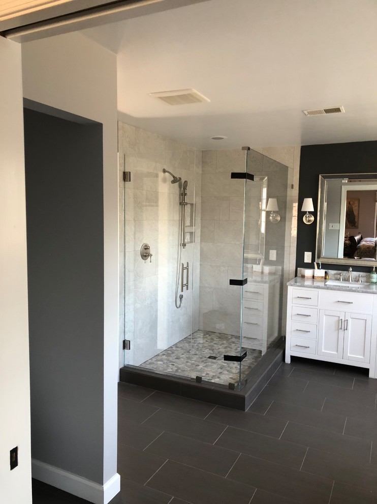 Mid-sized modern master bathroom in DC Metro with shaker cabinets, white cabinets, a corner shower, beige tile, grey walls, slate floors, an undermount sink, granite benchtops, grey floor, a hinged shower door and grey benchtops.